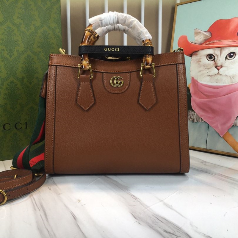 G*u*i top handle bags